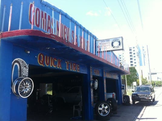 Quick Tire's blue-painted storefront, new and used tires